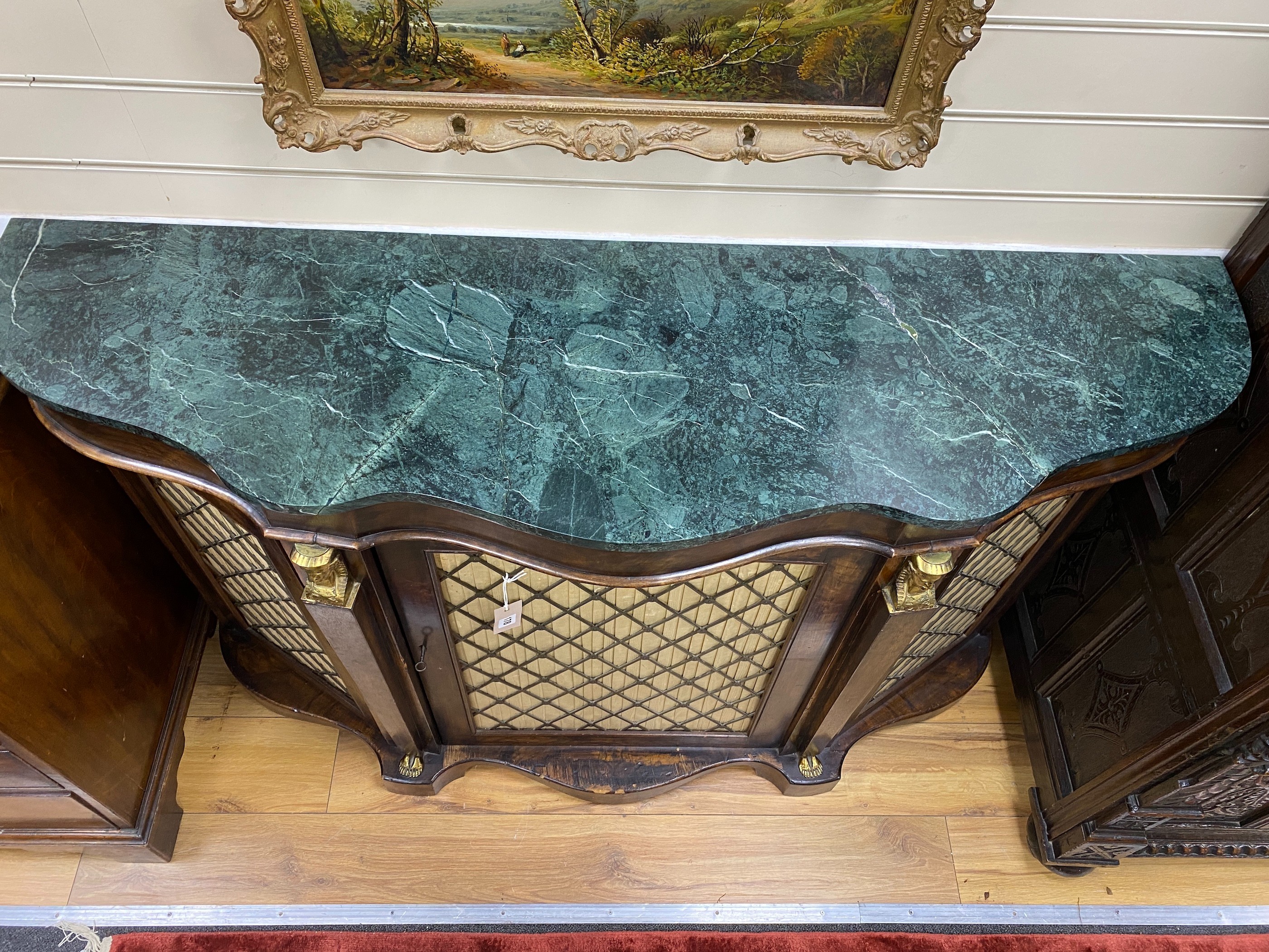 A Victorian serpentine front marble top walnut side cabinet, (marble split), width 136cm, depth 39cm, height 87cm